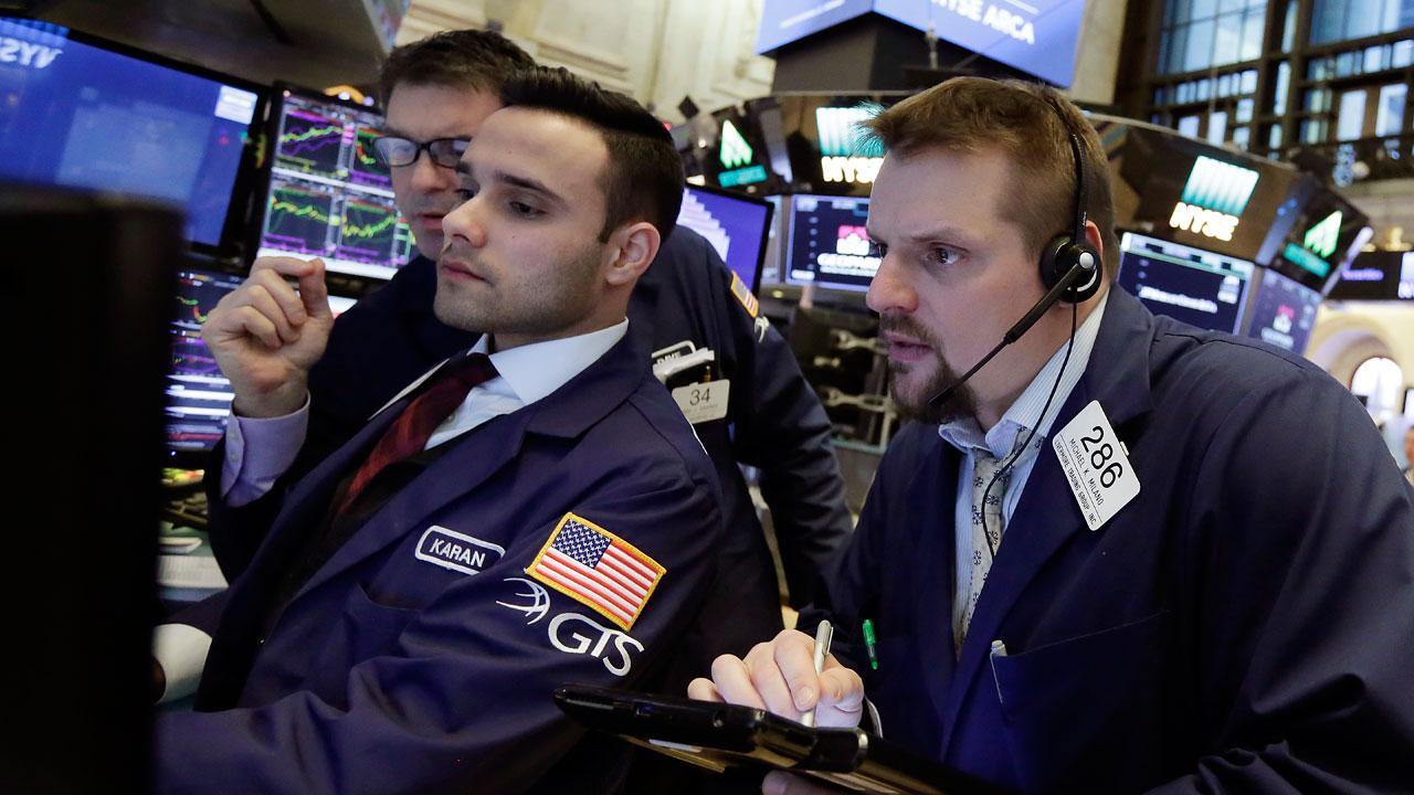 Stocks pull back from record highs