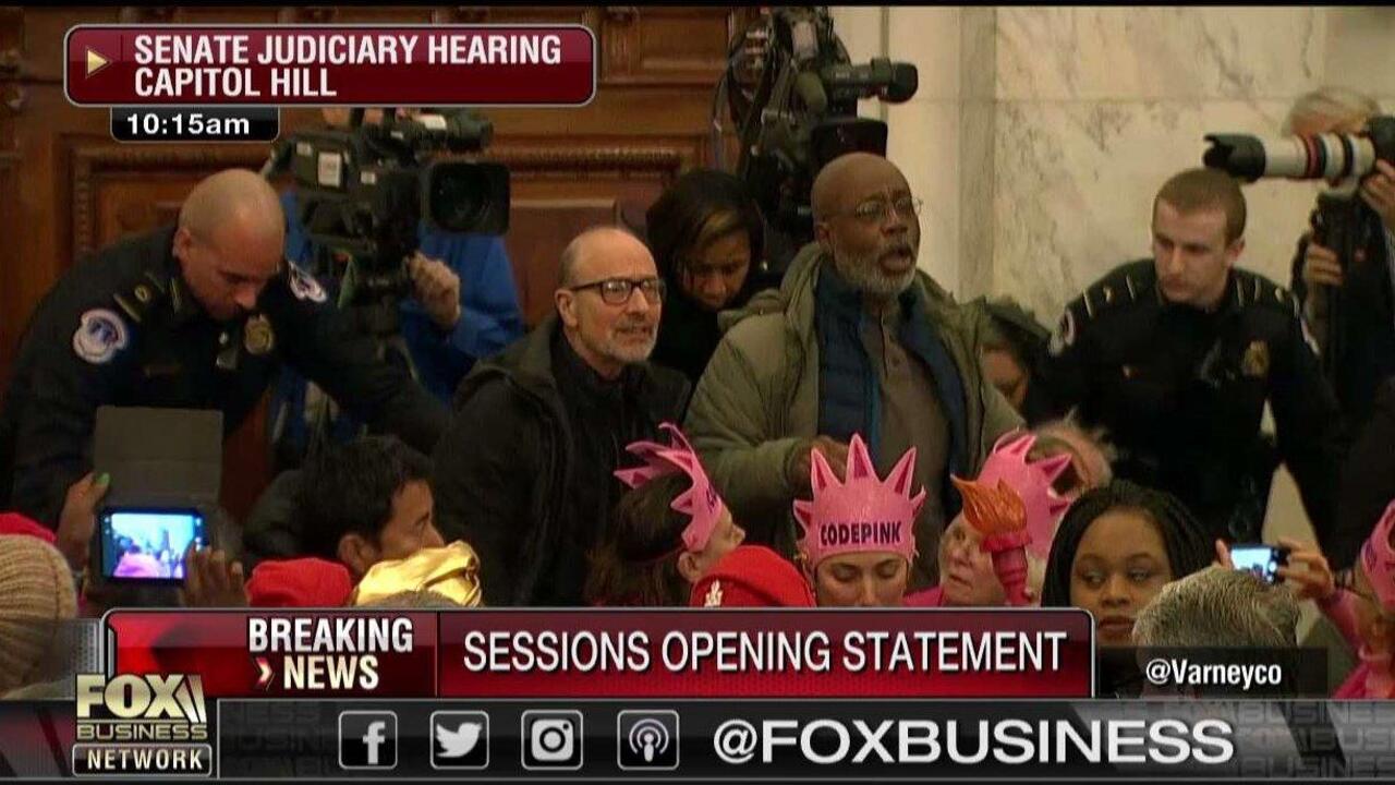 Protesters disrupt Sessions hearing 