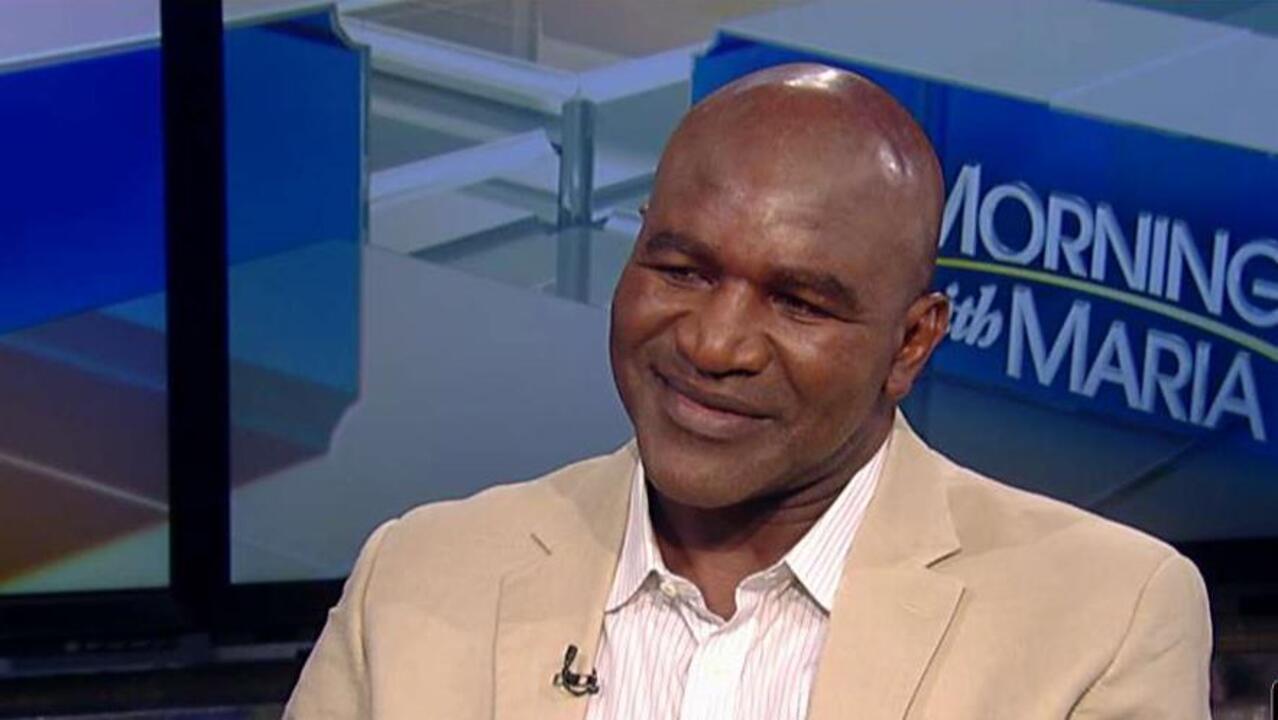 Harvey recovery: Evander Holyfield pitching in with relief efforts