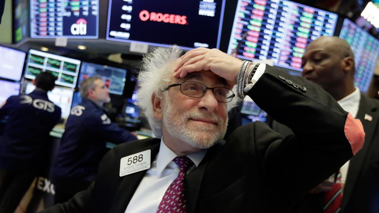 Stocks fall amid positive economic data