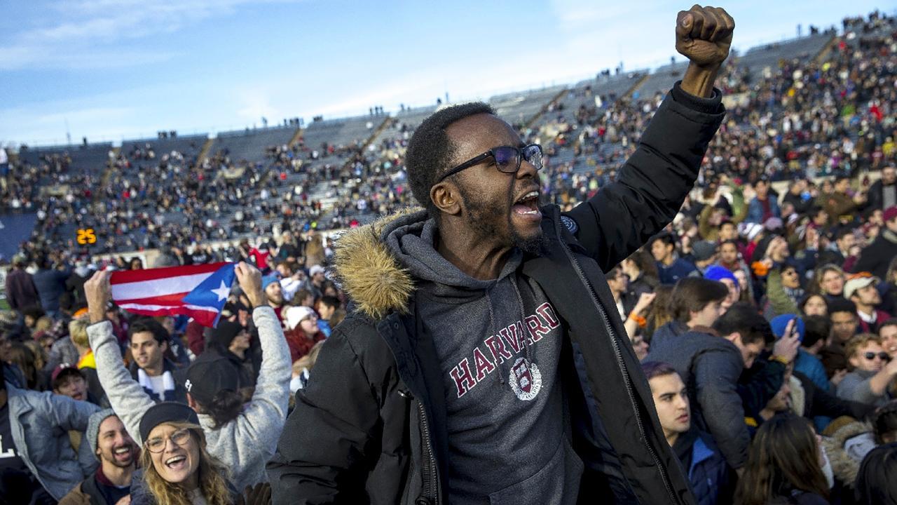 Climate activists storm Harvard-Yale football game