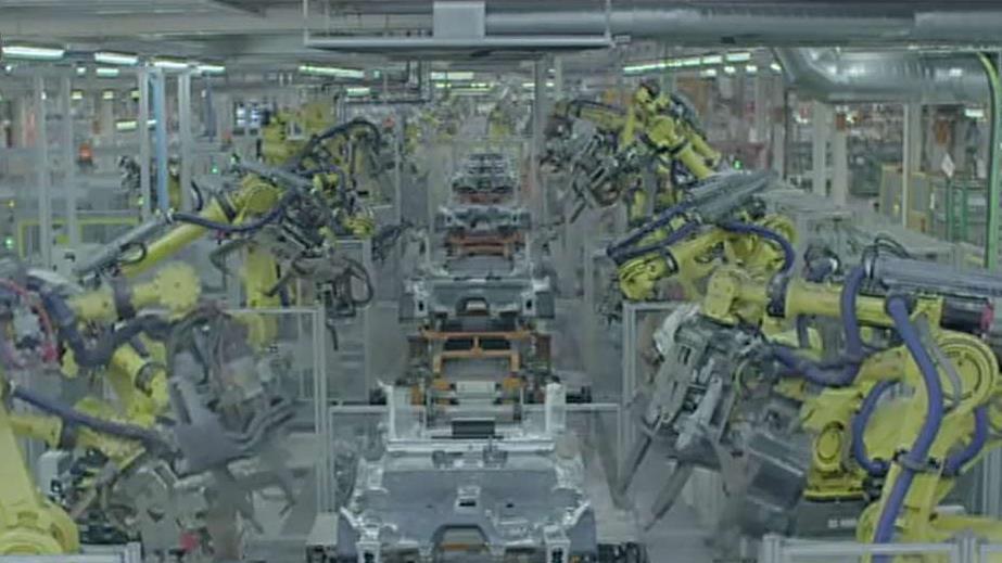 Dancing robots building cars