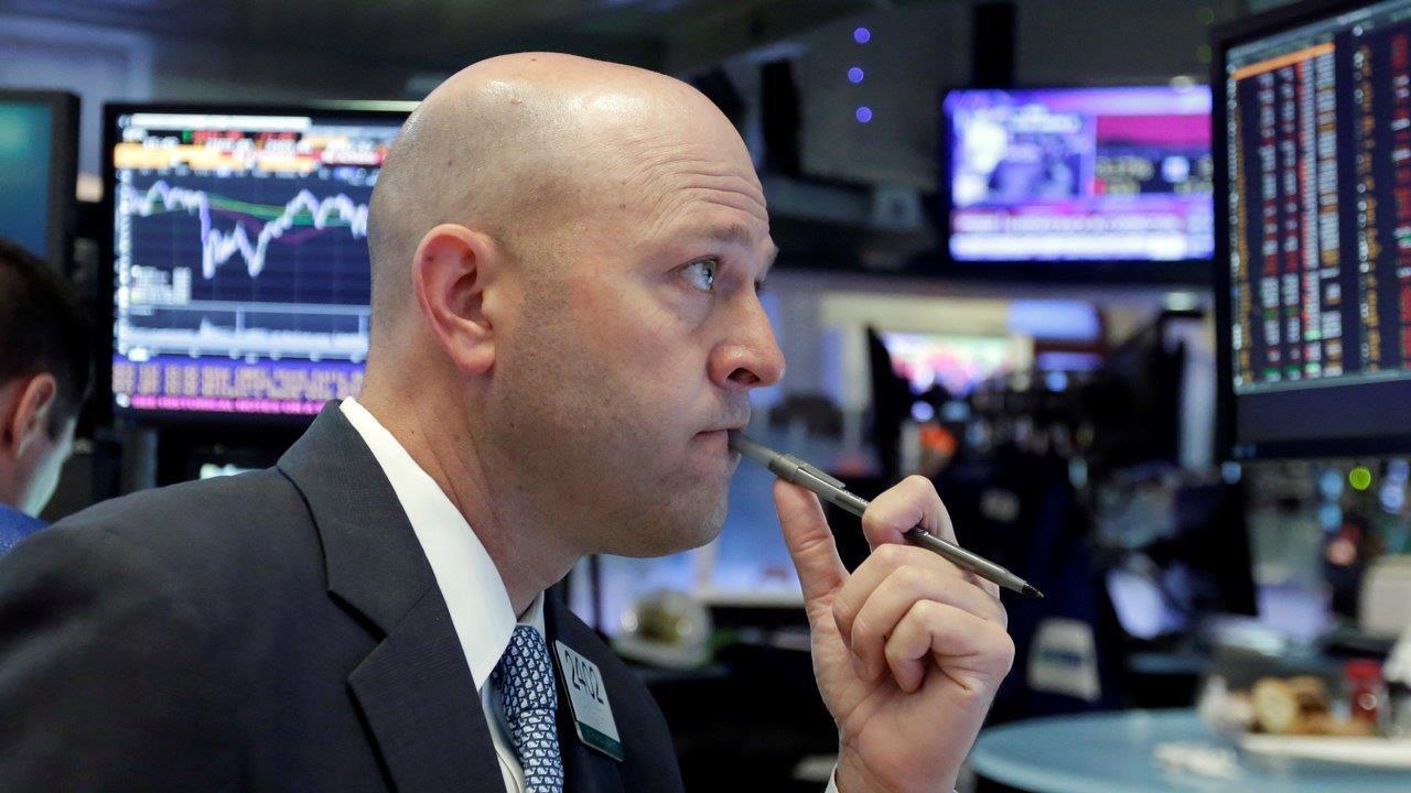 Consumer stocks help Wall Street hit record highs