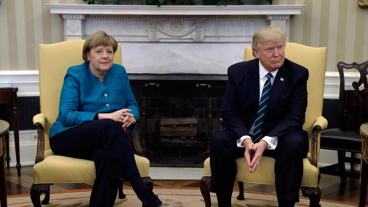 Trump meets Merkel to talk refugee crisis, trade