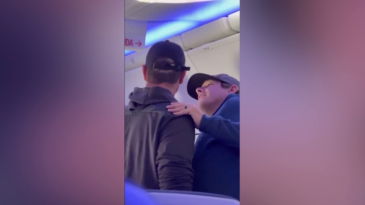 Video footage taken from inside the plane shows two men fighting before other passengers intervene during an Oakland, California, to Kauai, Hawaii, flight on Monday. (Credit: @kauai.airBnB via Storyful)