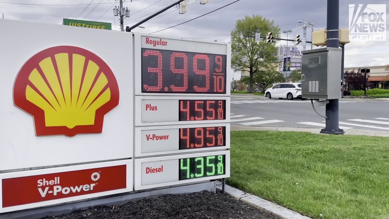 Americans filling their tanks up at a gas station in Alexandria, Virginia, reacted to gas prices rising over 50% since January 2021, when President Biden took office.