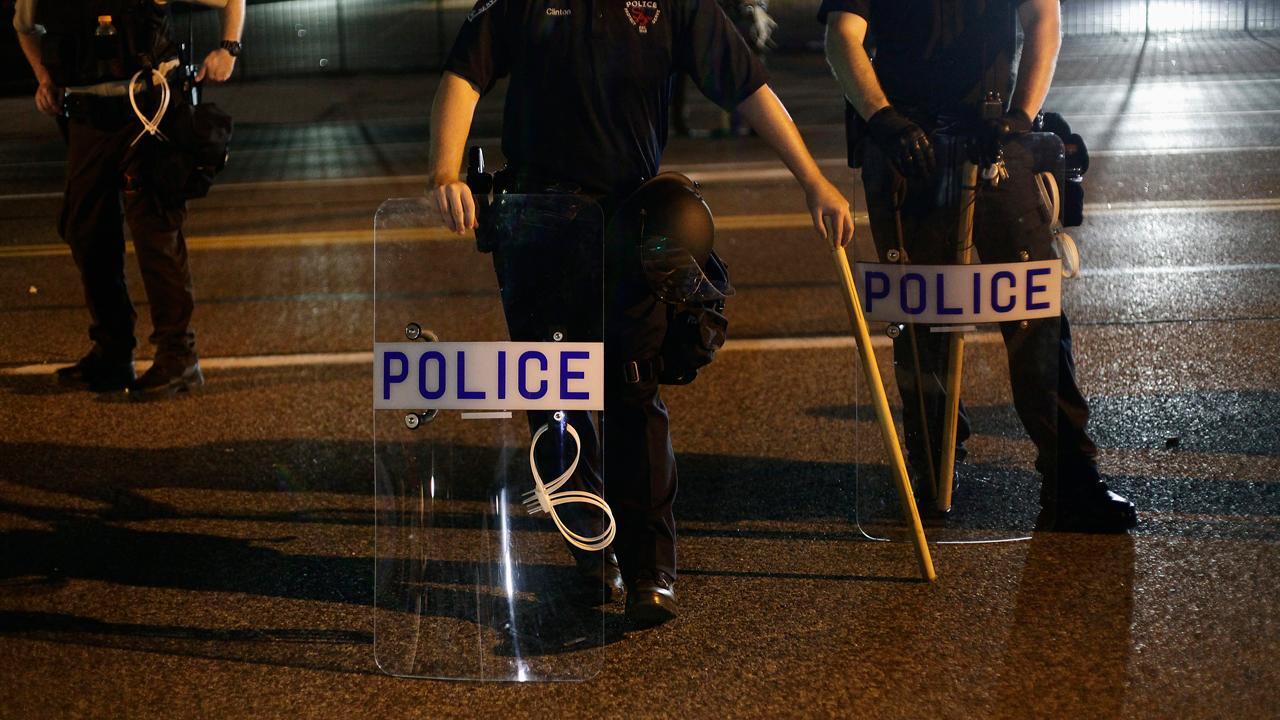 How can society ensure the safety of police officers?