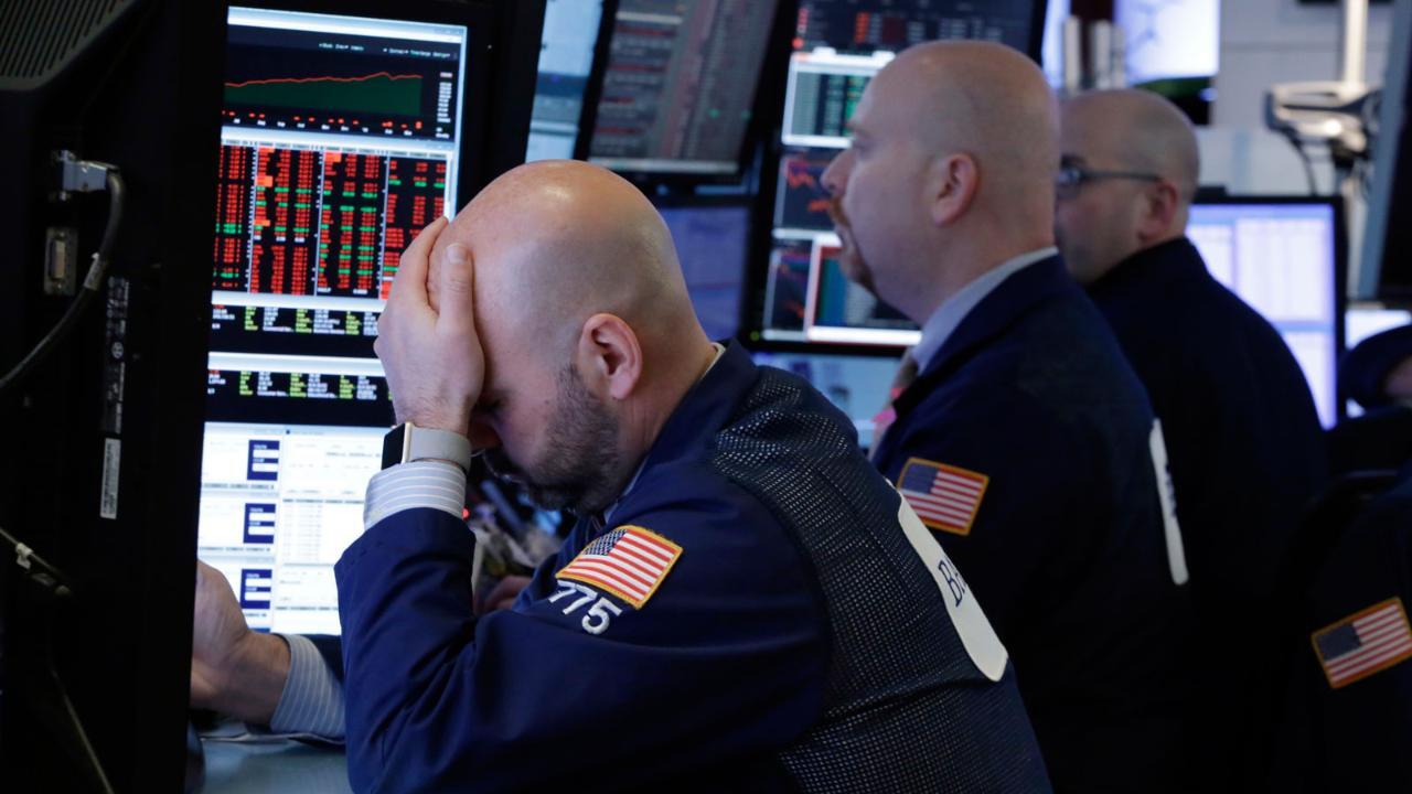Stocks close in the red as financials fall