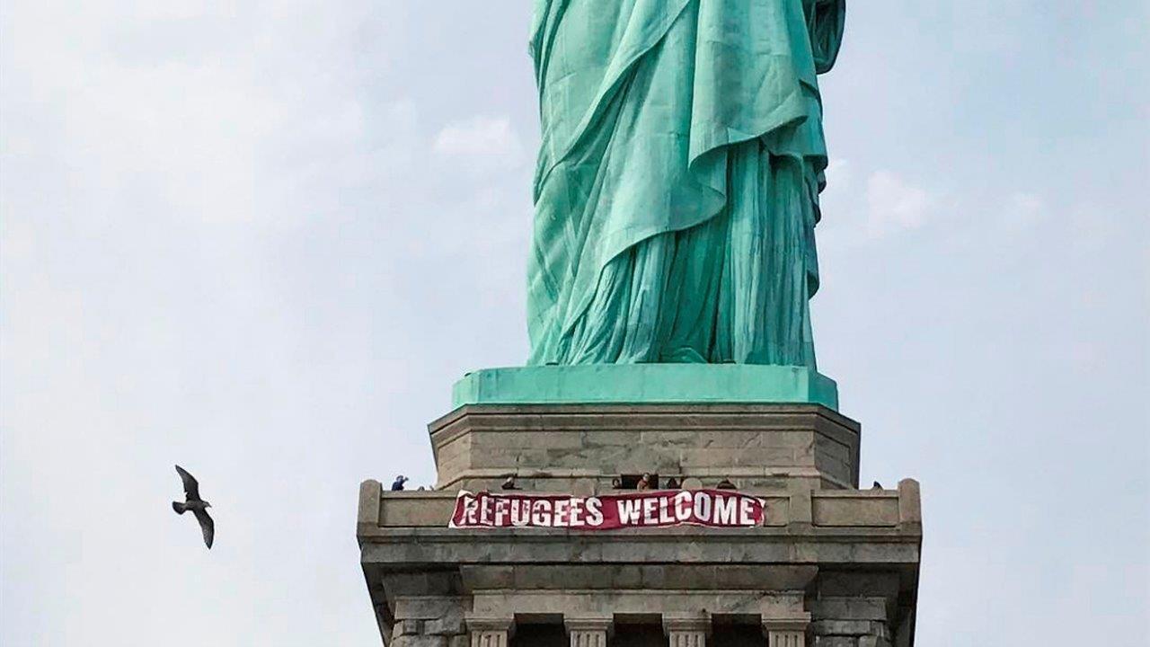 Banner hung on the Statute of Liberty not protected under free speech?