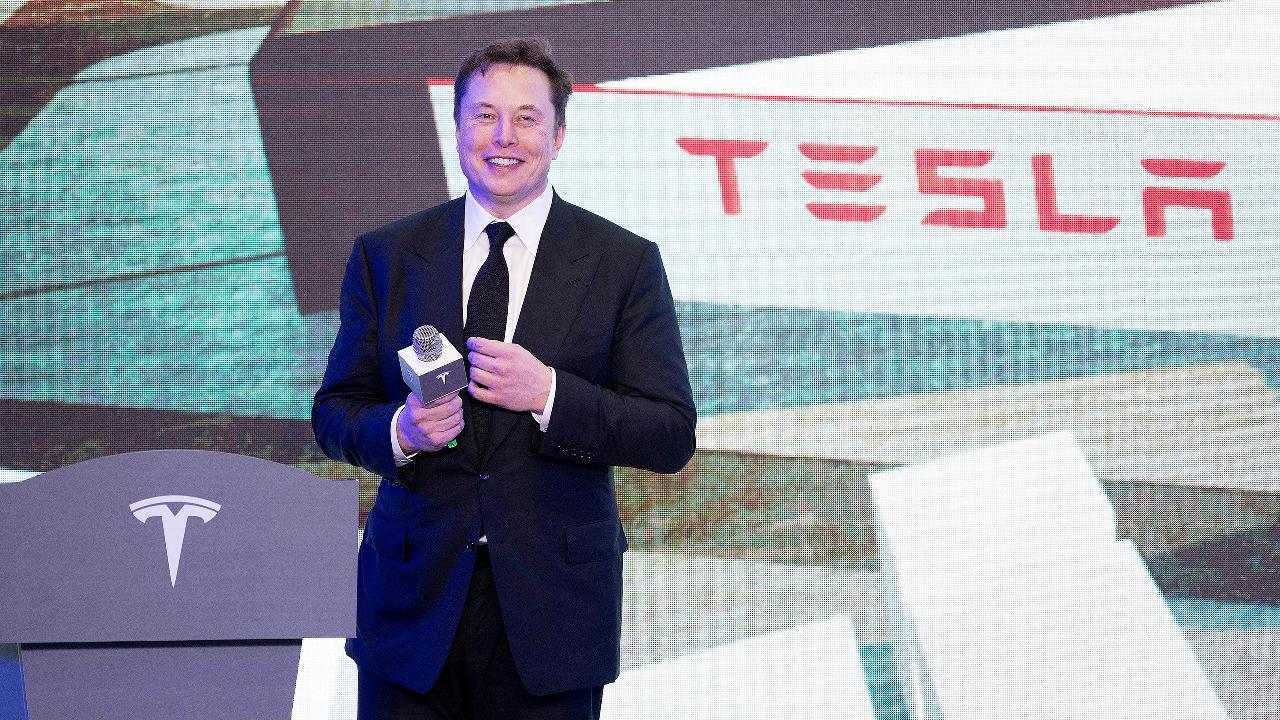 Elon Musk strips on stage at Tesla's Shanghai plant