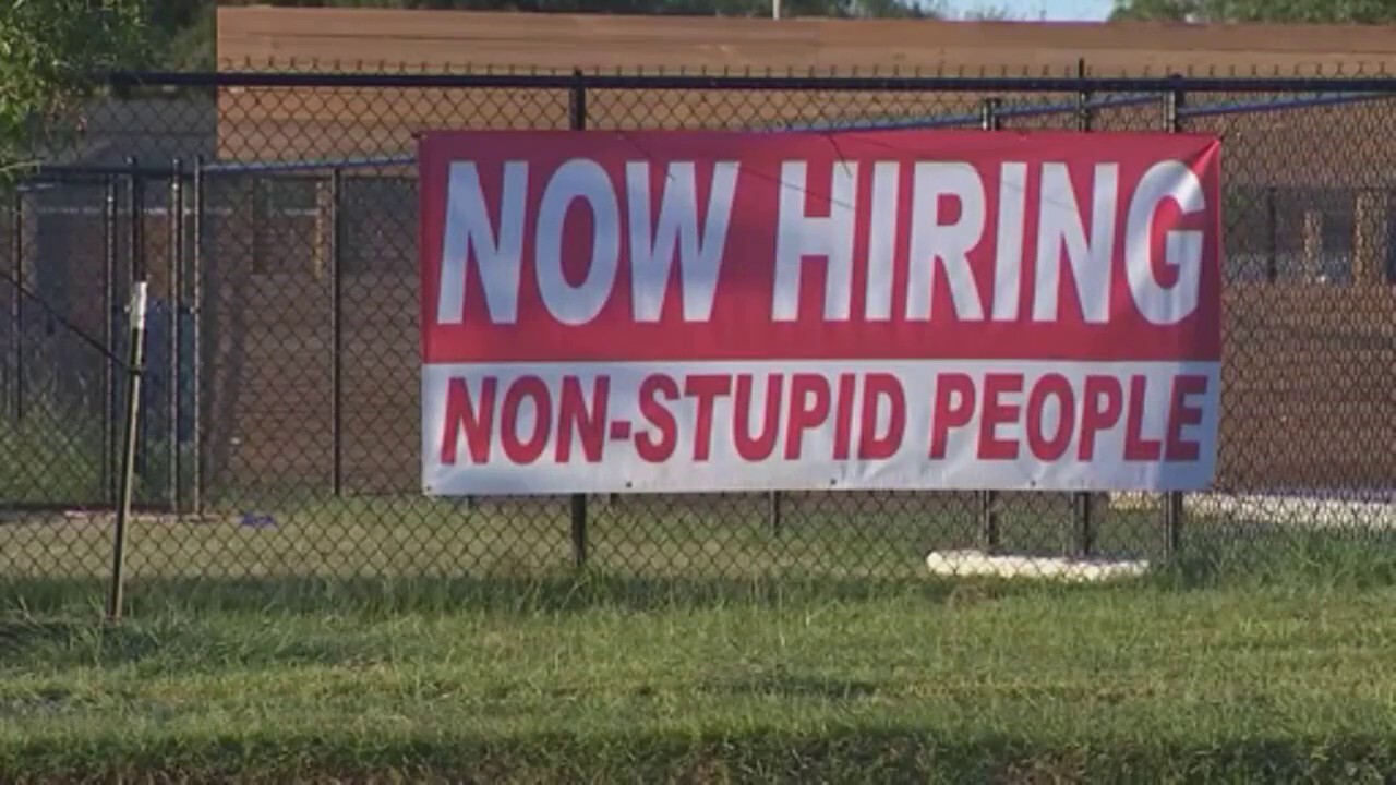 Texas "non-stupid people" sign outside pet business