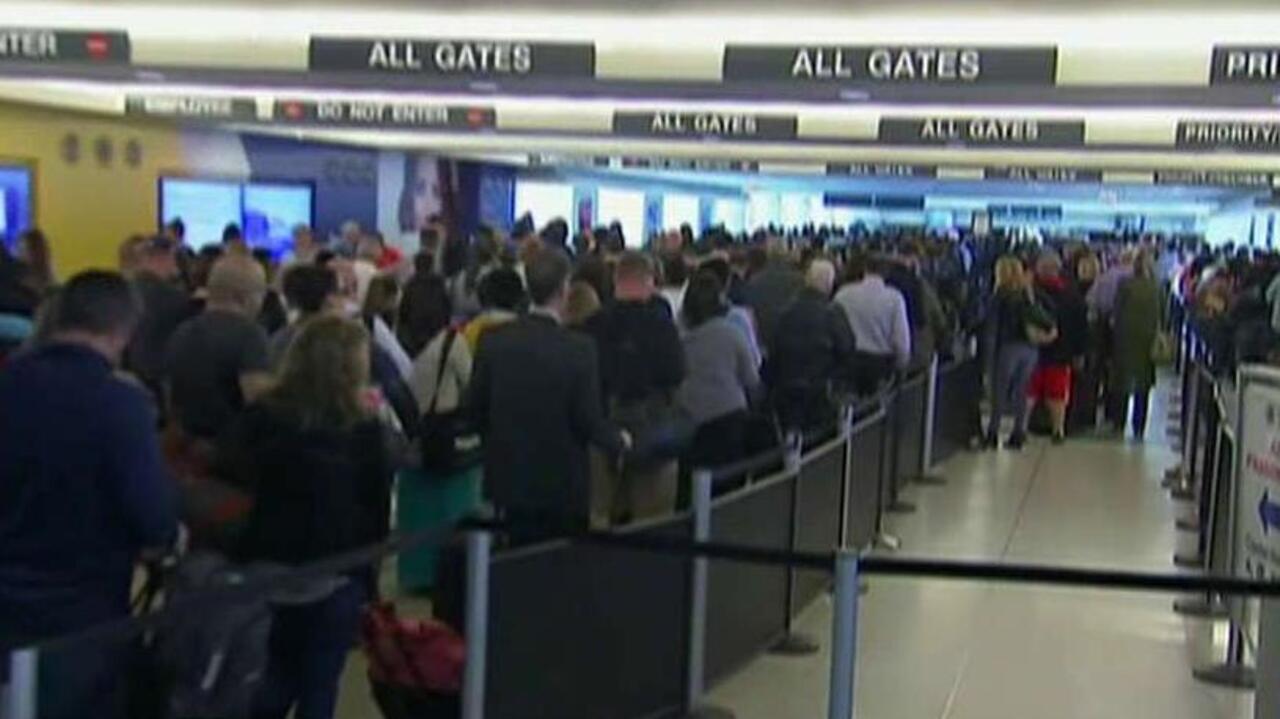 Why long lines plague air travelers