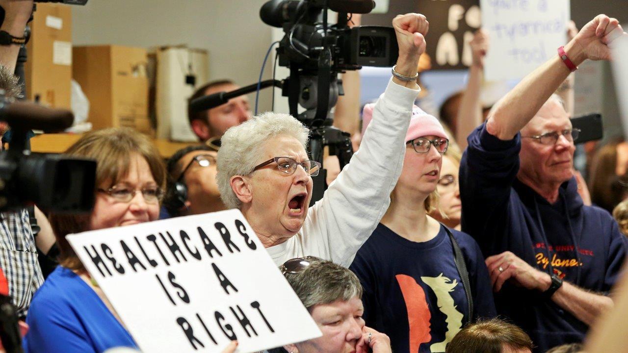 Protests erupt at town halls across the country