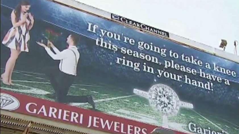 Jeweler accused of racism for 'take a knee' billboard