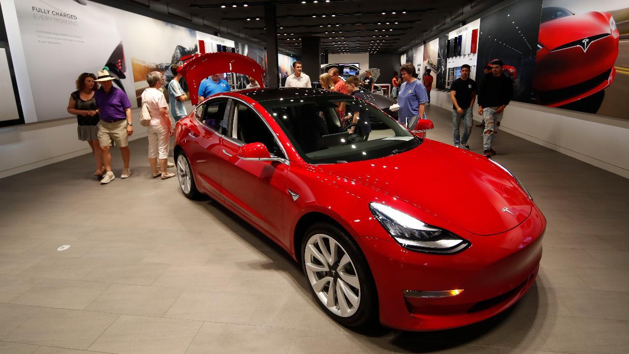 Tesla cutting seven percent of its workforce as part of effort to lower the price of Model 3