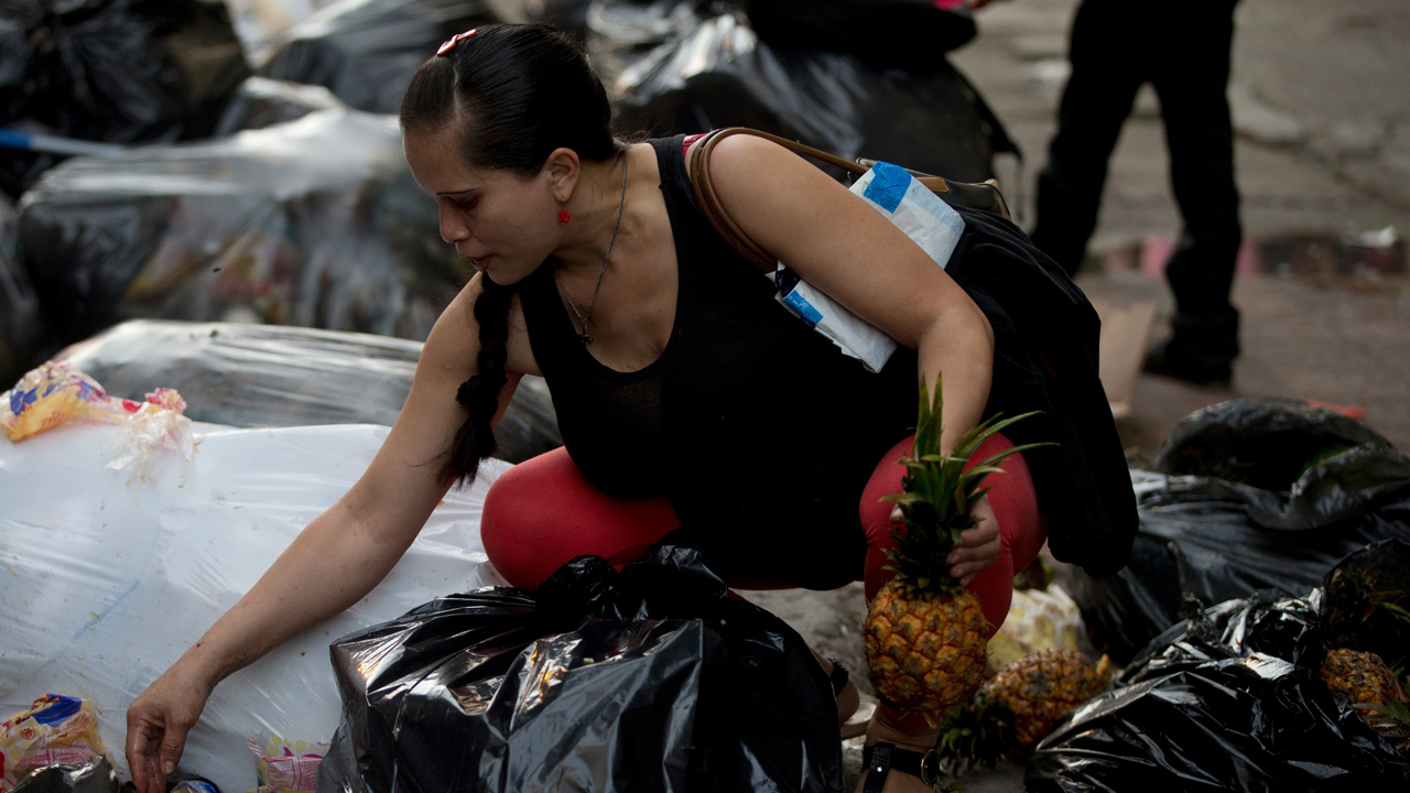 Venezuelans selling trash for cash