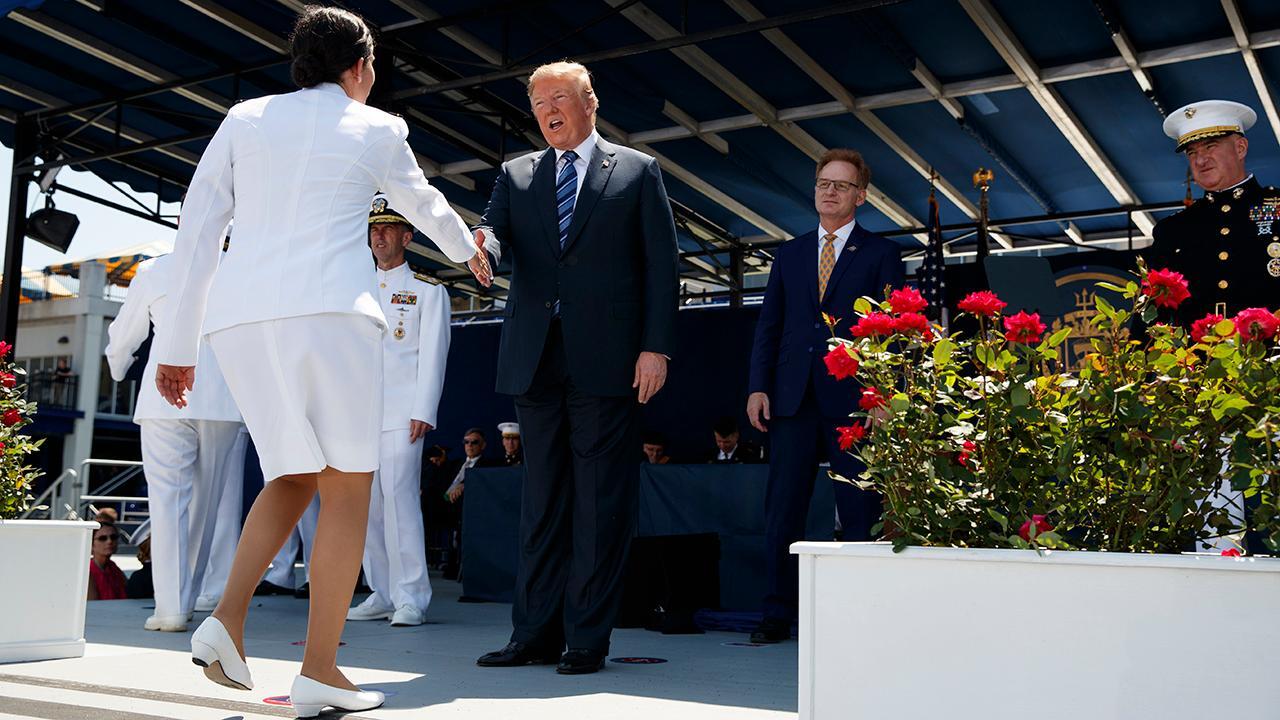Trump shakes hands with nearly 1,100 US Naval Academy graduates