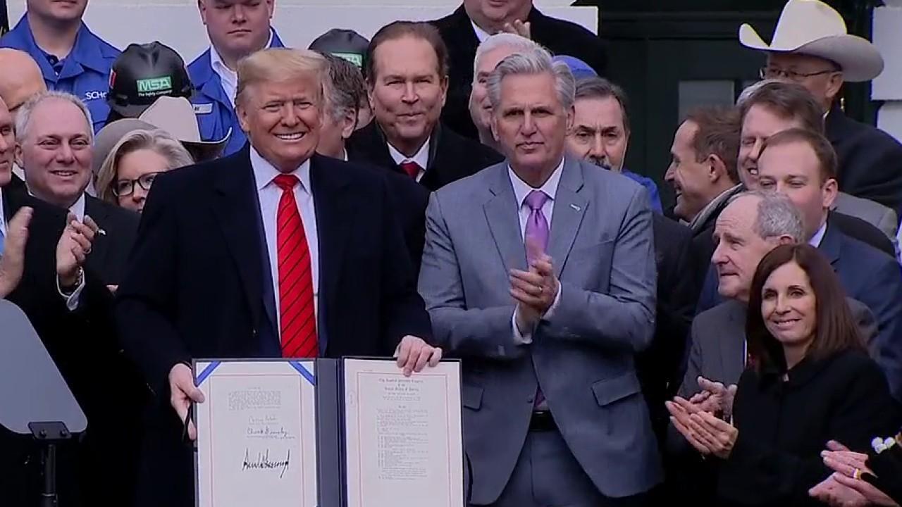 President Trump signs USMCA into law 