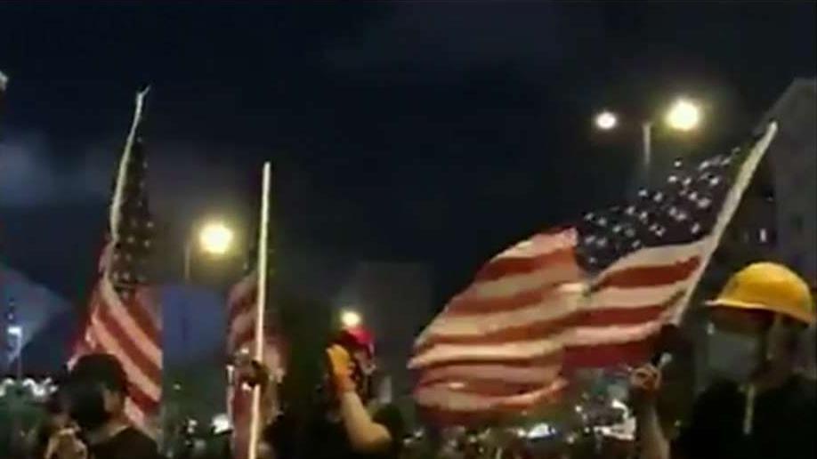 Hong Kong protesters held American flag, sang US national anthem