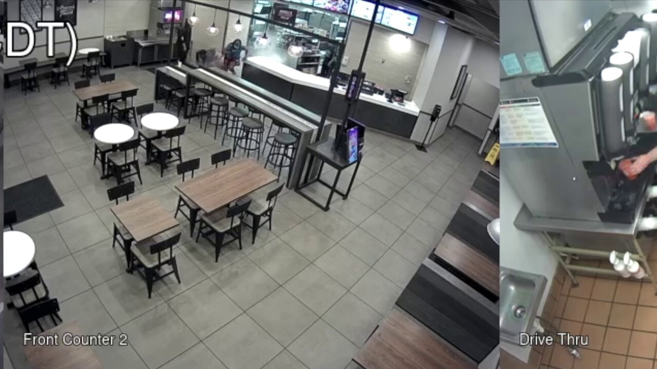 Surveillance footage shows the moment a Taco Bell store manager covered a woman and girl in hot water, the woman claiming she and the girl were left feeling like they were "burning from the inside out".