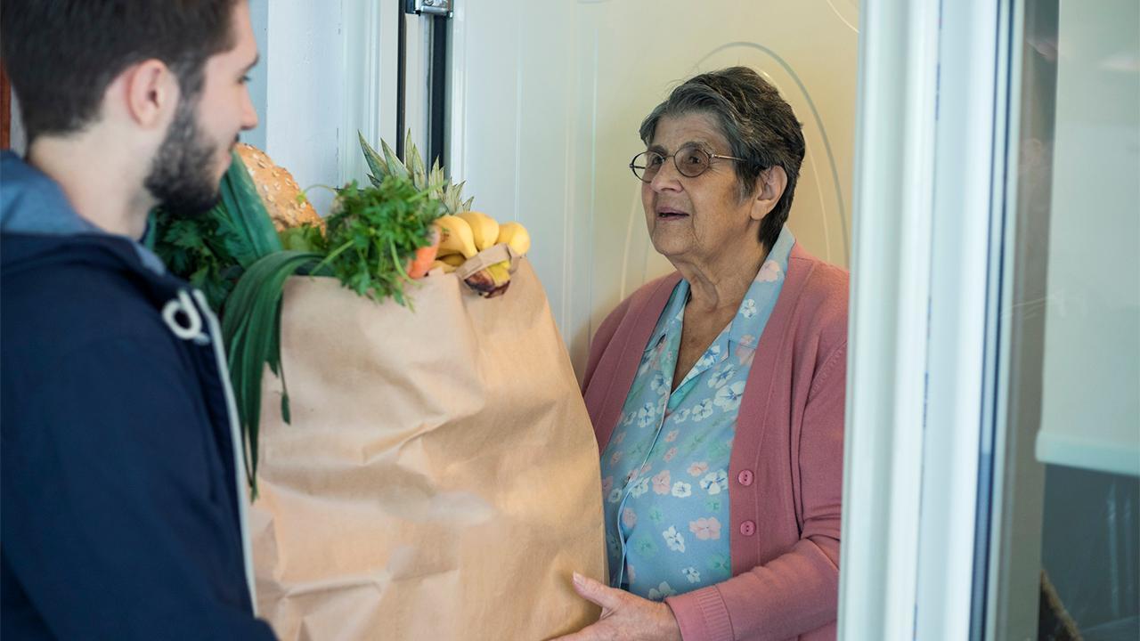 Restaurant manager selling groceries to sustain business