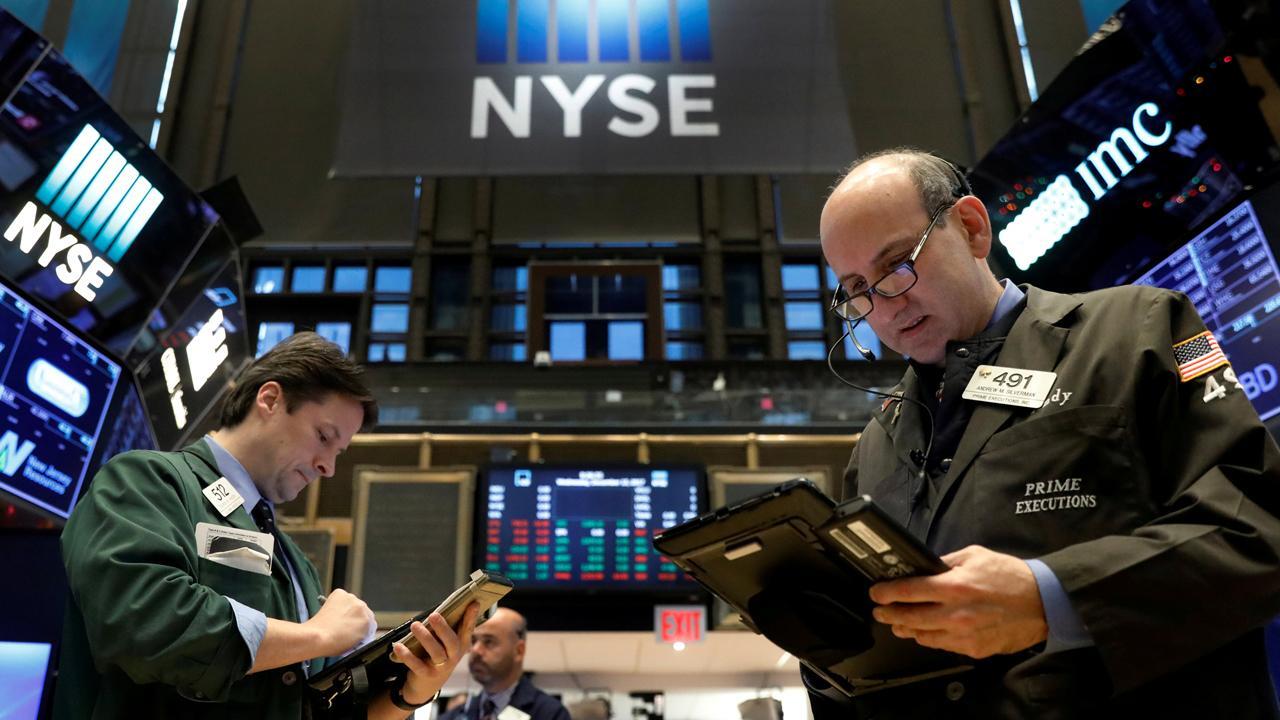 Record closes for Nasdaq, S&P, Dow ends lower