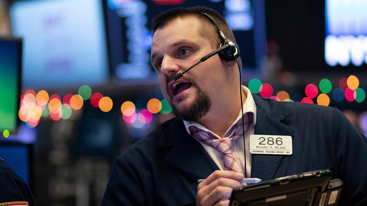 Dow crosses above 27,000 mark for the first time