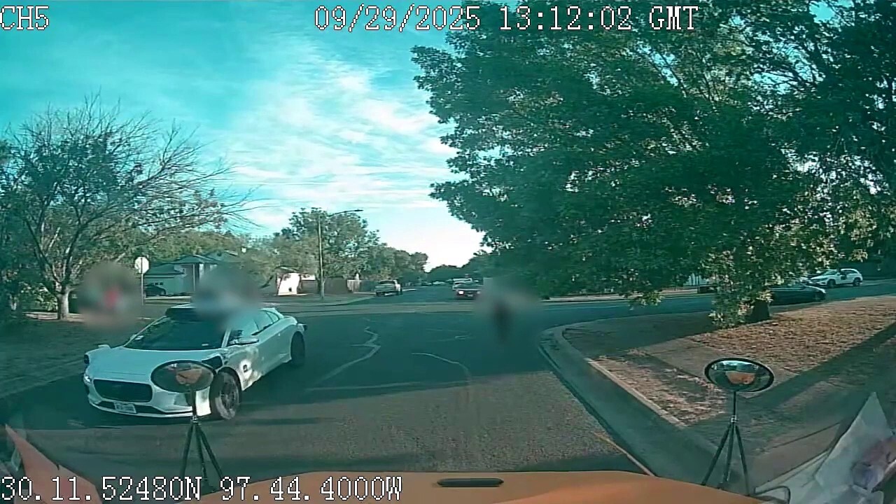 Self-driving vehicles caught on camera proceeding past stopped school buses