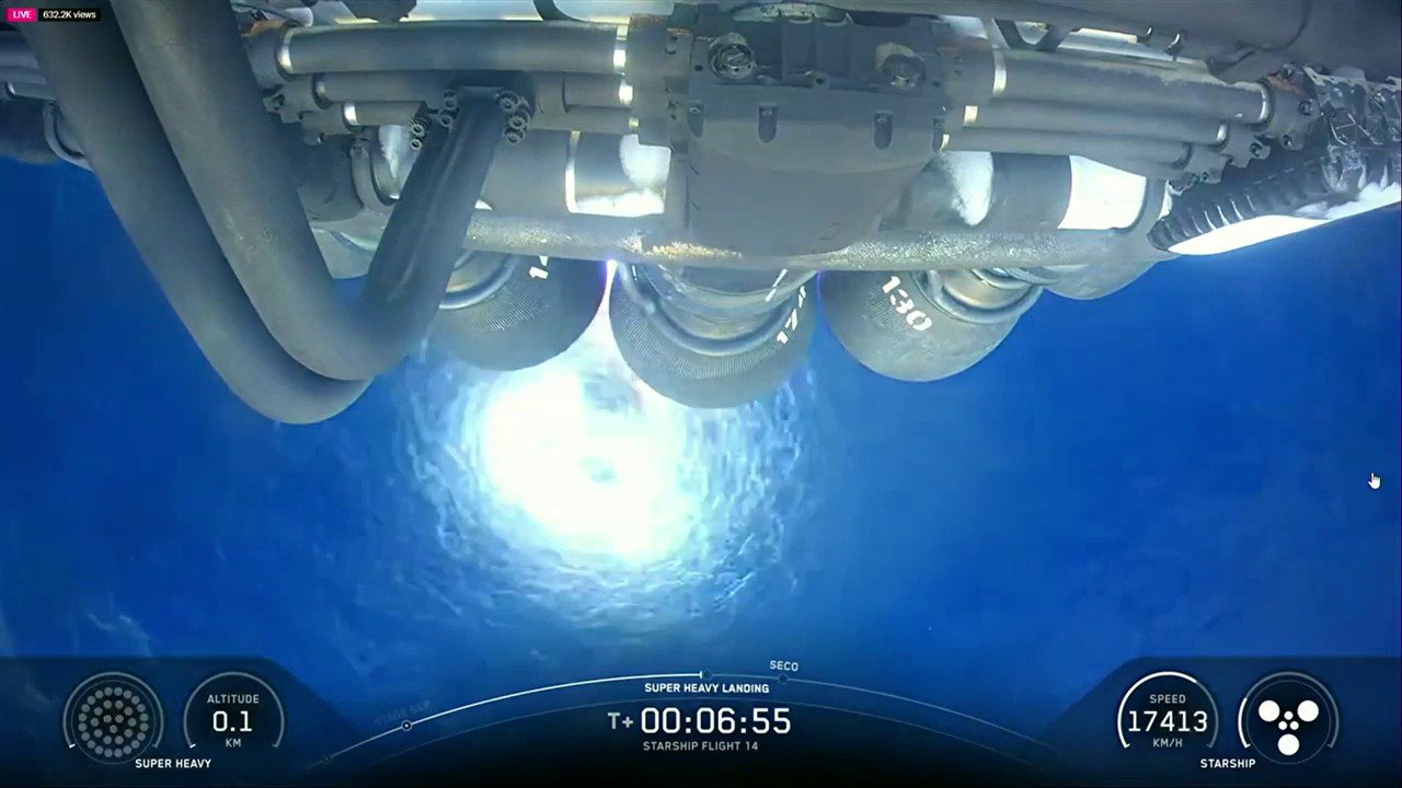 SpaceX engineers erupted in cheers as a Starship booster splashed down off the coast of Starbase, Texas, Monday after a simulated landing burn.