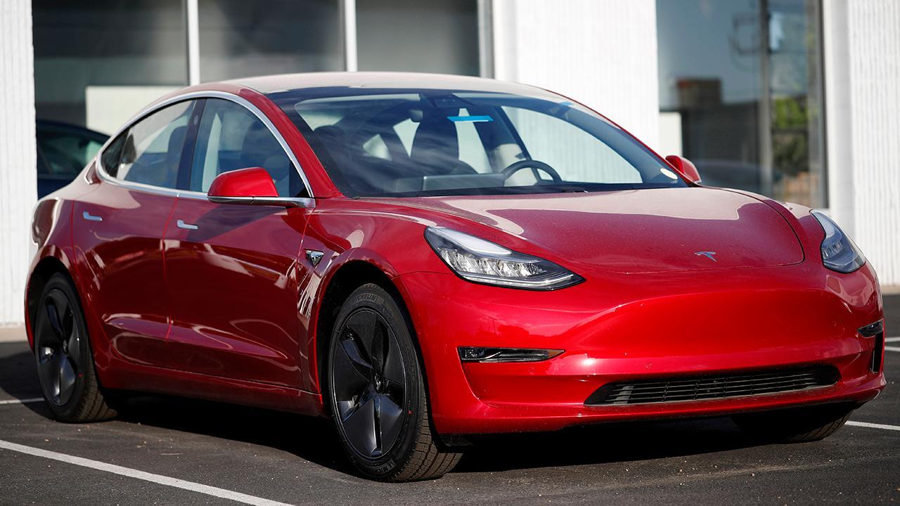 Musk says Tesla reached production goal with its Model 3