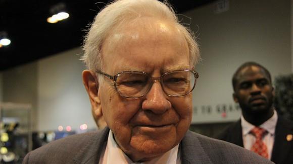 Warren Buffett on Apple investing in Tesla: It would be a poor idea