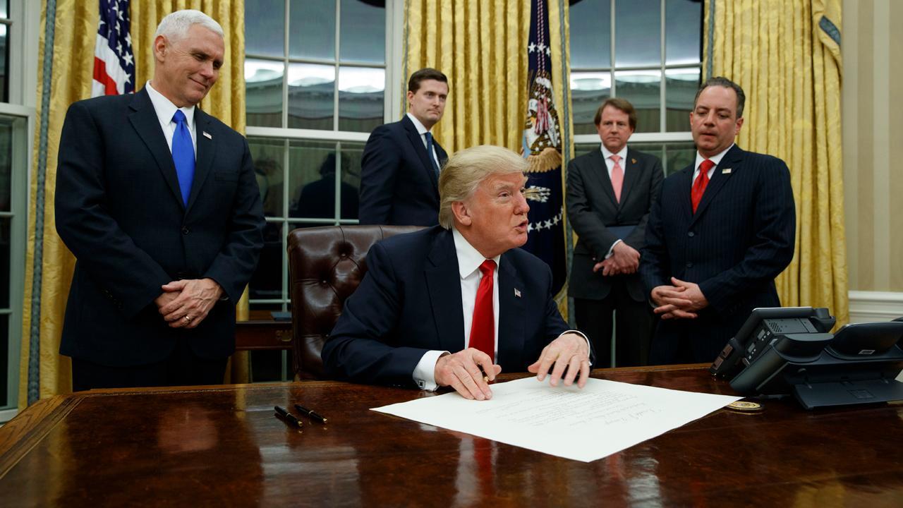 Trump puts pen to work signing executive orders