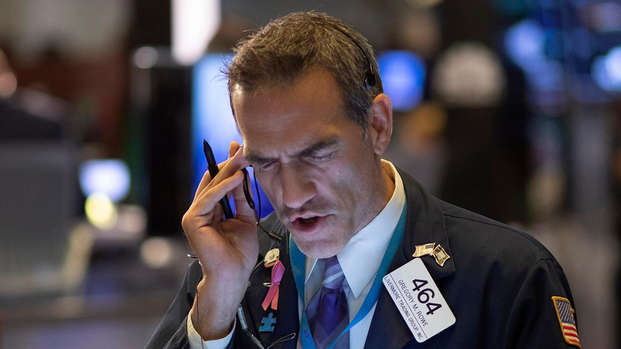 Stocks close September with modest gains; iconic Jennifer Lopez dress for sale