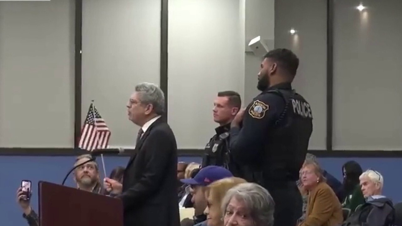 Edison, NJ resident removed from town meeting for waving American flag protests 'prop' ban