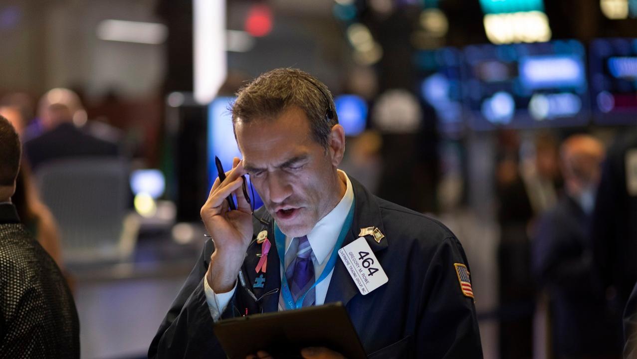 Dow closes down, driven by trade headlines 