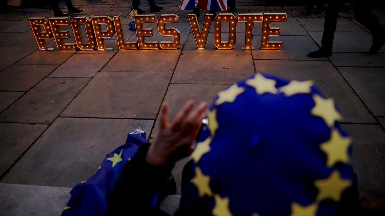 UK’s Theresa May delays Brexit vote