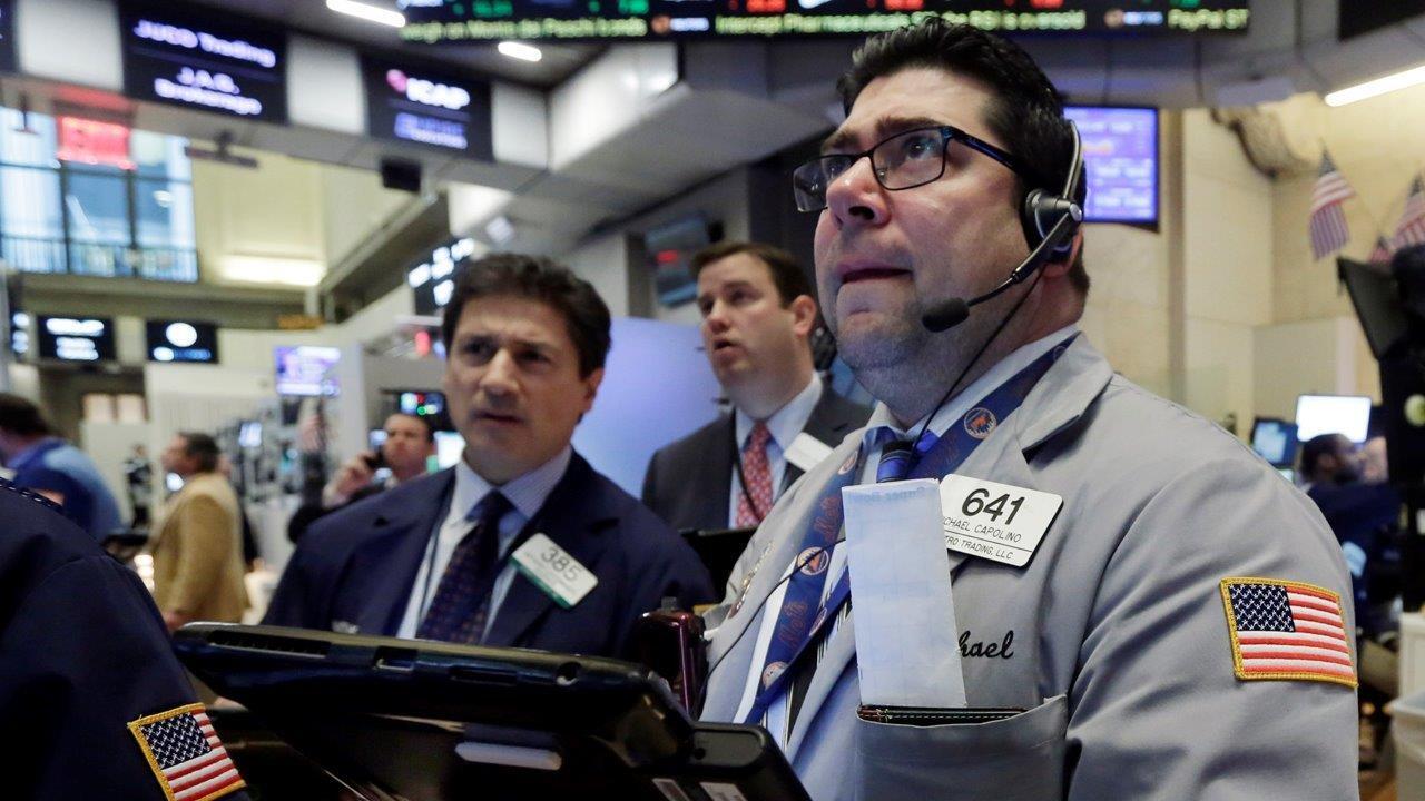 Dow dives, trims losses with late rally