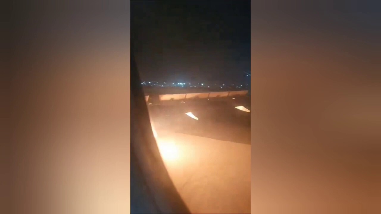 An Air India Express plane was forced to make an emergency landing Saturday night after an engine caught fire shortly after takeoff, the airline said. (Credit: Viral Press)