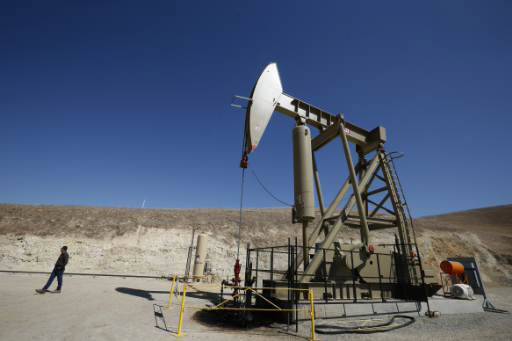 Oil spikes, settles at nearly $50 per barrel