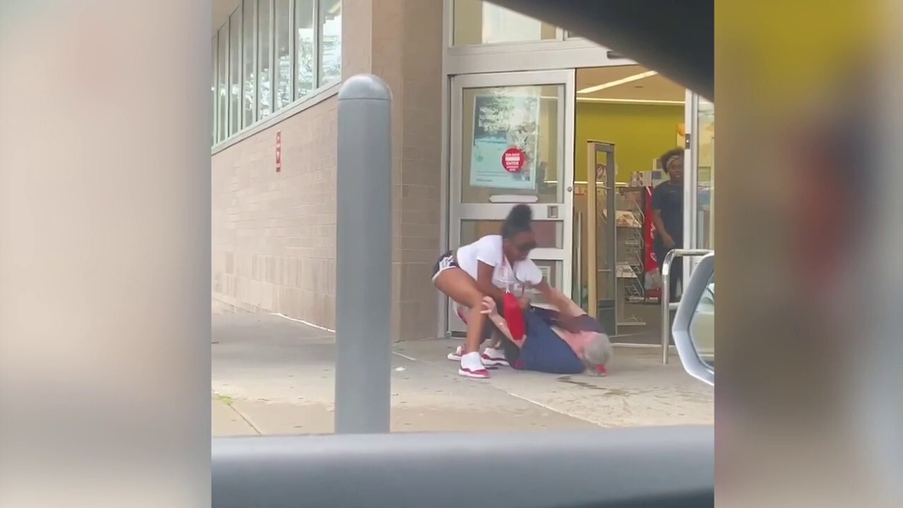 A video shows a teenage girl punching an elderly employee, while in front of an Independence, MO Walgreens (Credit: Independence Police Department).