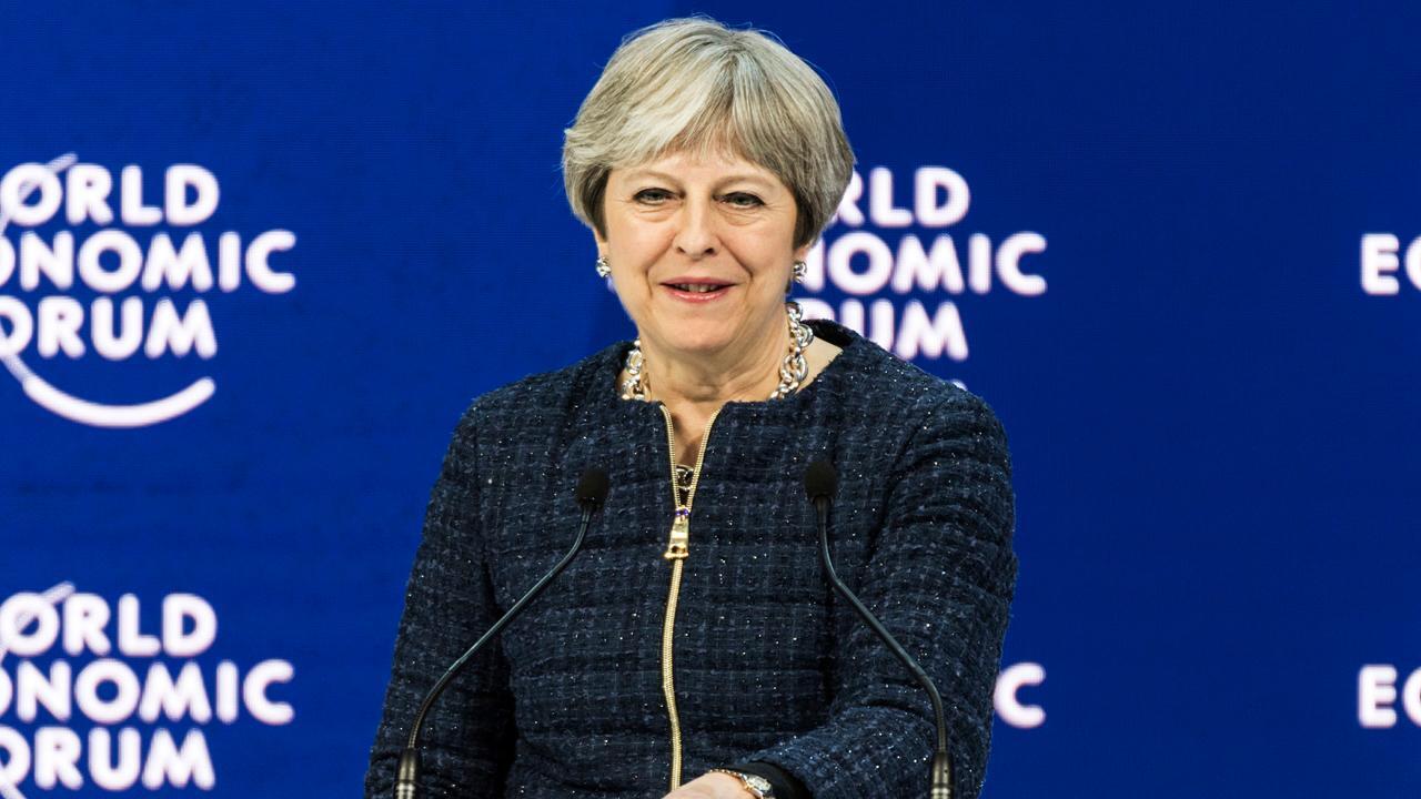 British PM May warns tech firms