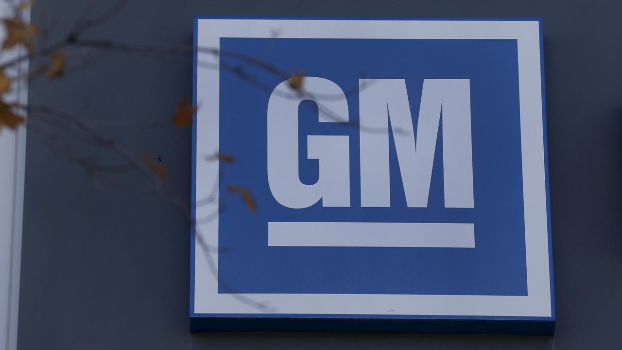 GM shares surge on investment from Japan's SoftBank