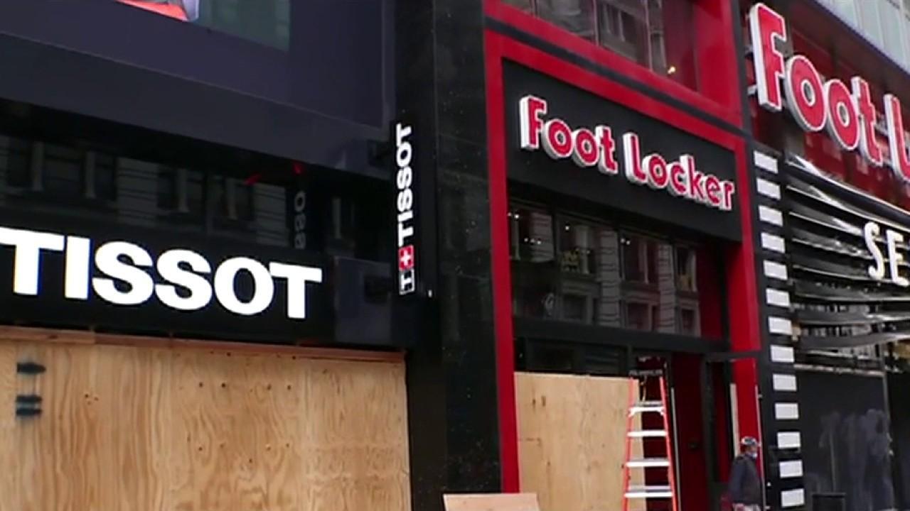 New York City retailers board up, gut stores to stop looters 