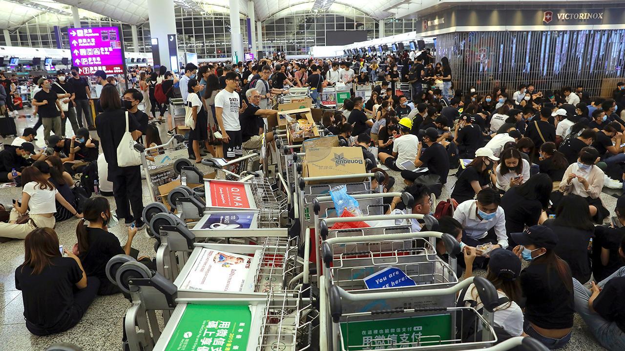 Hong Kong airport protests descend into violence