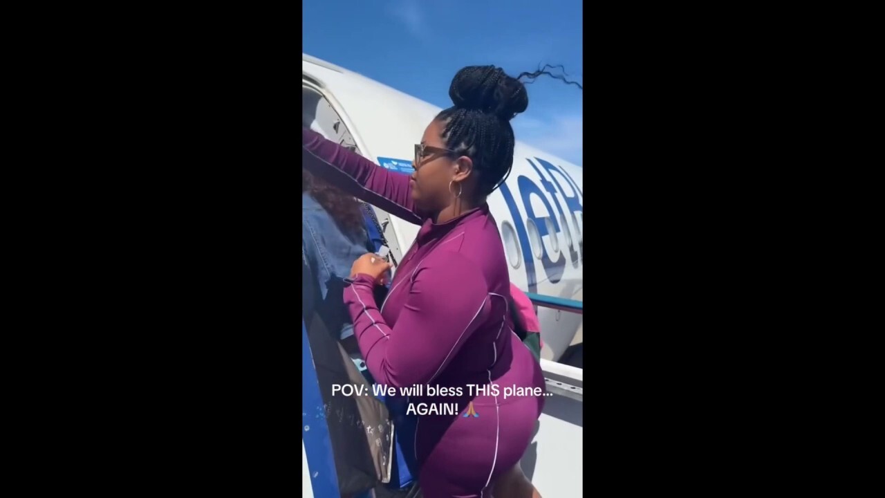 JetBlue passenger Desiree Salter posted video of her blessing a plane with oil to social media on Feb. 15, and the video has gone viral following recent flight incidents. Credit: @desireesalter /TMX